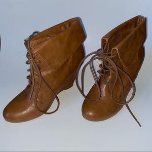 Tan wedge booties w/ laces.